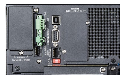 Back side of black Eaton 9SX15KPMAU UPS showing green terminal block and multiple usb serial and parallel ports
