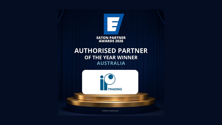 White rectangular plaque with blue io trading logo on golden pedestal awarded ip trading partner of the year 2026 australia