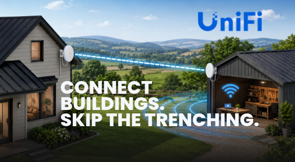 Outdoor point-to-point wireless bridge unit mounted on a pole, linking two buildings in Australia