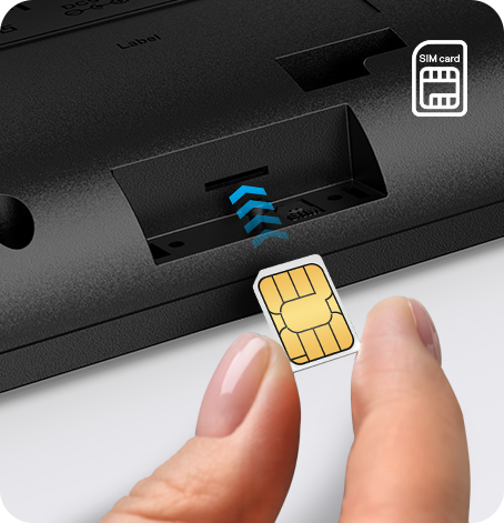 Inserting gold nano-SIM into Yealink T74LTE 4G desk phone slot