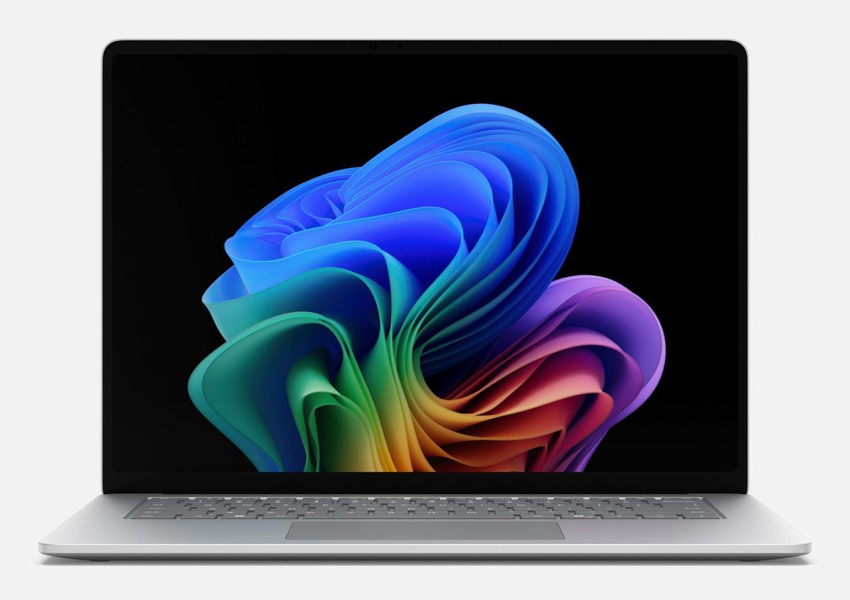 Silver microsoft surface laptop 8 15in with illuminated keyboard featuring snapdragon x2 elite 12-core processor