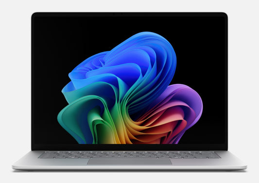 Silver microsoft surface laptop 4 with illuminated keyboard featuring snapdragon x2 elite 12-core processor and 64gb ram