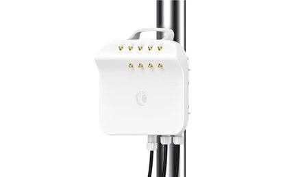 White rectangular cambium networks ePMP 4500C 5 GHz wireless access point with gold antenna connectors mounted on a pole