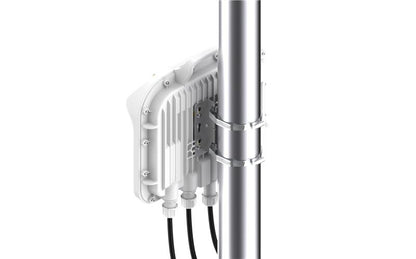 White outdoor wireless access point cambium networks c050940a811d mounted on metal pole with multiple cables visible from back side