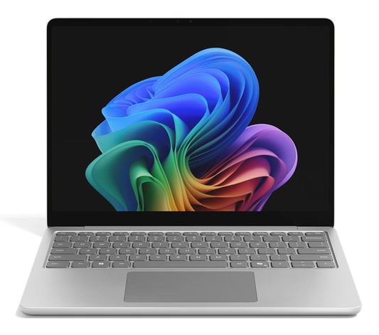 Silver microsoft surface laptop 3 with a sleek minimalist design and vibrant windows 11 wallpaper on screen