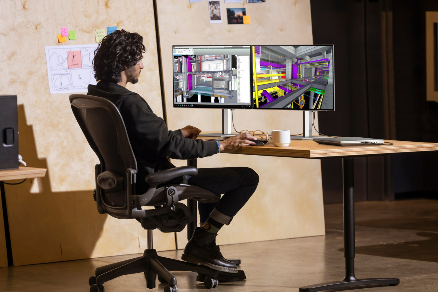 Black ergonomic office chair with adjustable armrests and five-wheel base suitable for comfortable office use