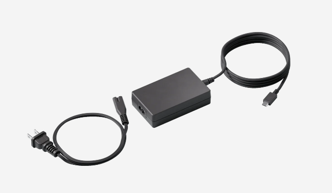 Logitech Extend 100W USB-C charger with coiled cable and dual connectors