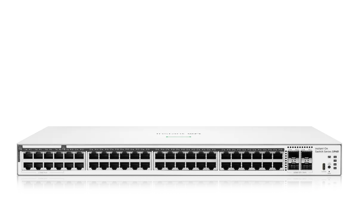 White hp instant on switch series 3940 with multiple ethernet ports and sleek minimalist design shown from the back side