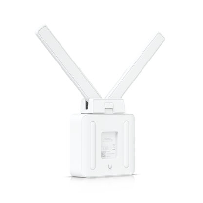 Ubiquiti UMR cellular router with V-shaped antennas and Netgear logo