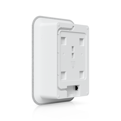 White plastic ubiquiti up-ai-speaker with textured edge and mounting slots for indoor poe ai speaker use